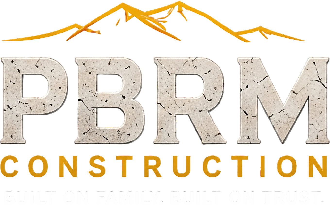 PBRM Construction logo with mountains and tagline